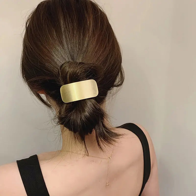 Goma para el pelo de metal dorado